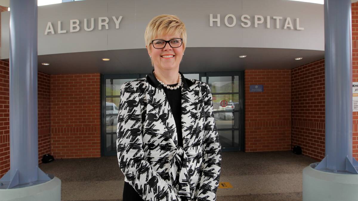 The new chief executive at Albury Wodonga Health Sue O’Neill ponders her new job outside Albury hospital yesterday. Picture: DAVID THORPE