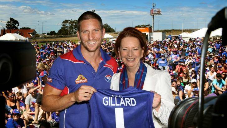 Former prime minister and Western Bulldogs no.1 ticket holder Julia Gillard with player Matthew Boyd. Photo: John Woudstra