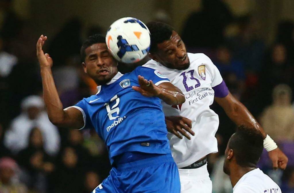 Saudi's al-Hilal forward Nasser Al-Shamrani vies for the ball with UAE's al-Ain defender Mohamed Ahmed during their AFC Champions League semi-final.