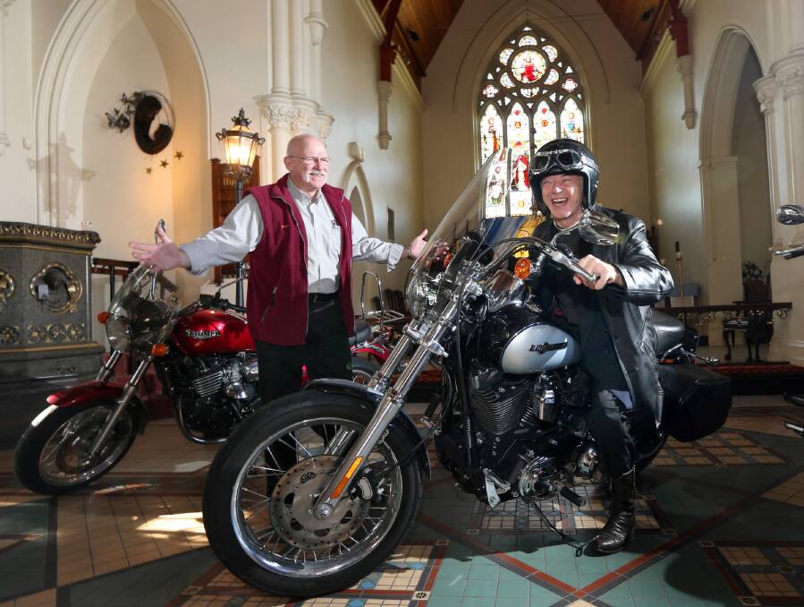 Wodonga Lions Club member Michael Georgiou and St Matthew’s priest Peter MacLeod-Miller with motorbikes which will feature at tomorrow morning’s service to acknowledge the contribution of Border Bike Fest donations to help the Border’s homeless. Picture: PETER MERKESTEYN