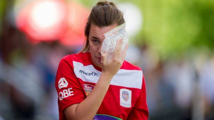 Glory keeper MacKenzie Arnold after copping a nasty hit from United's Michelle Heyman during a match.  Photo: Jay Cronan