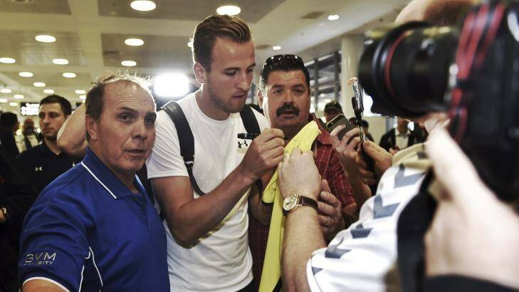 Welcome atention: Tottenham Hotspurs' striker Harry Kane is greeted by fans at Sydney airport. Photo: Brendan Esposito