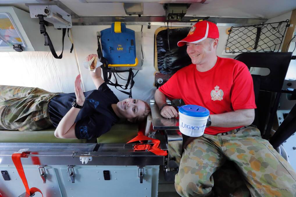 Medic trainee Private Bree Childs and Major Damien Batty from the Army School of Health put their Bushwacker Ambulance on display at Albury’s Homemaker Centre yesterday. They were raising money for Legacy, which cares for families of those who have served in the Australian Defence Force. Picture: KYLIE ESLER