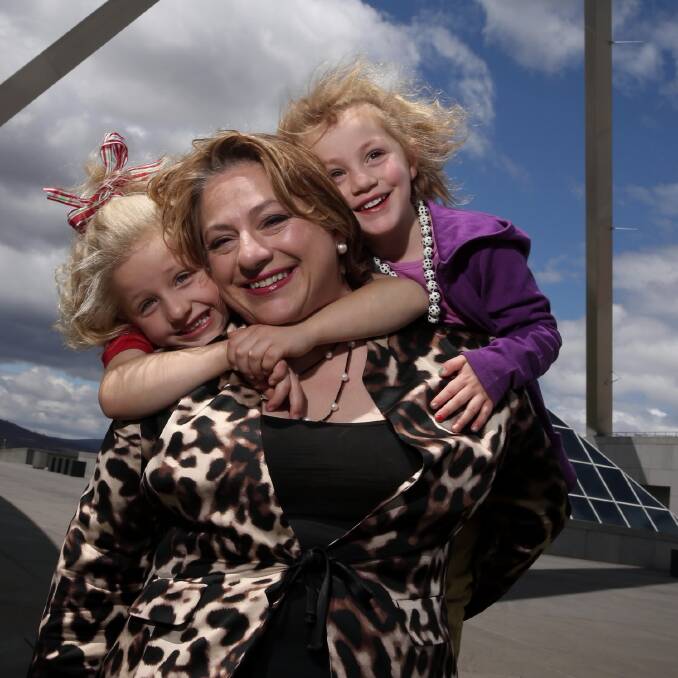 Sophie Mirabella, with her children Alexandra and Kitty, on the roof of Parliament House in Canberra. Picture: FAIRFAX