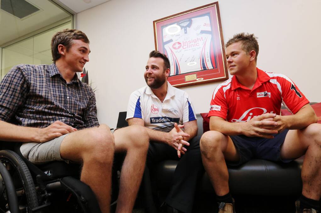 James McQuillan with Charity Big Bash cricketers Trent Ball and Thomas Stead at Insight Clinic. Picture: JOHN RUSSELL