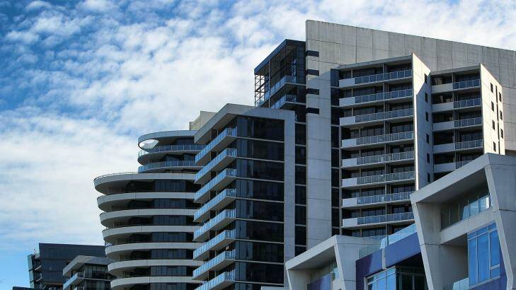 Apartments in Melbourne's Docklands could be pulling down the median growth rate. Photo: Graham Denholm