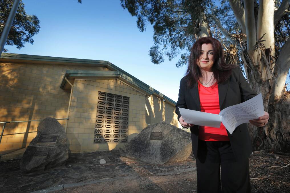 Spokeswoman for the Table Top NBN action group, Sarah Schmidt, reviews her notes of the meeting. Picture: TARA GOONAN