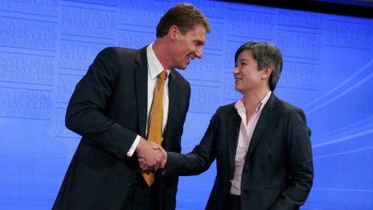 Senators Wong and Bernardi shake hands at the end of the debate. Photo: Alex Ellinghausen