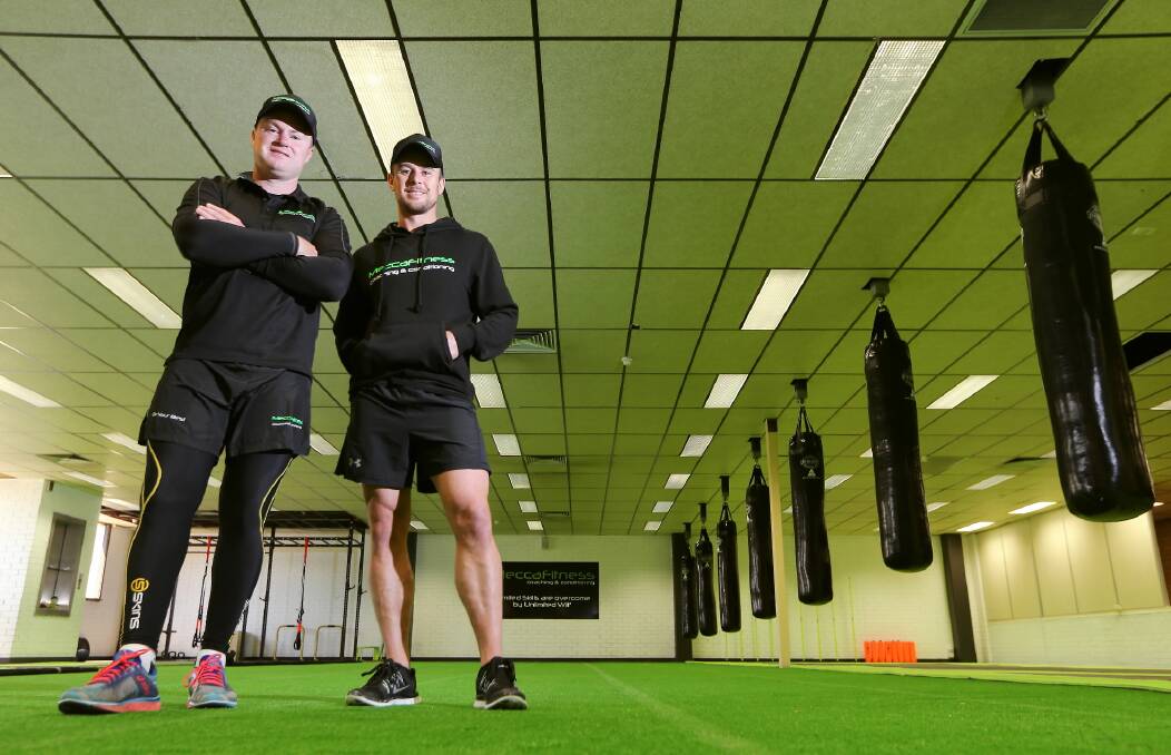 Mick Richards and Luke Brauer at Mecca Fitness Coaching and Conditioning yesterday. Picture: JOHN RUSSELL