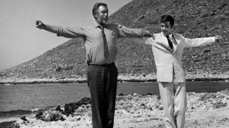 Anthony Quinn steps out with Alan Bates in Zorba The Greek.