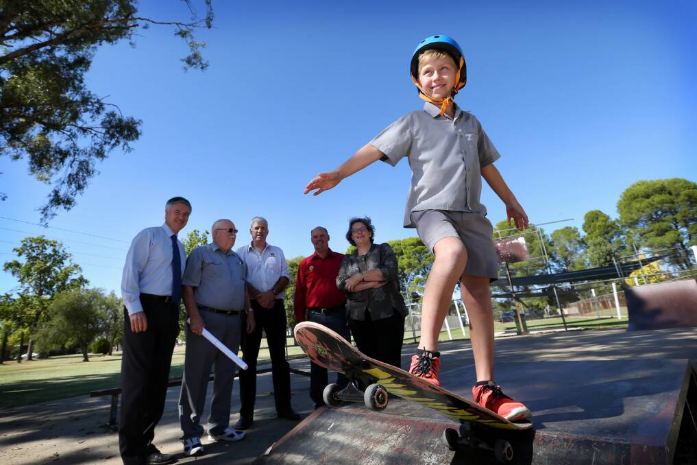 Member for Albury Greg Aplin, Henty skate park committee chairman Kevin Fogarty, Henty Community Bank’s Matt Bolger , Henty Rotary president Gary Terlich, Heather Wilton and Blake Roulston, 9, of Henty, were all delighted about the grant to build a new dedicated skate park. Picture: MATTHEW SMITHWICK