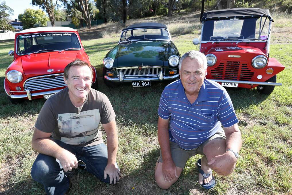 Mick King and Ron Franks with a 1970 Mini Cooper, a MGB 1966 and an early Mini moke which will be on display at the inaugural Minis on the Murray Show ’n’ Shine. Picture: PETER MERKESTEYN