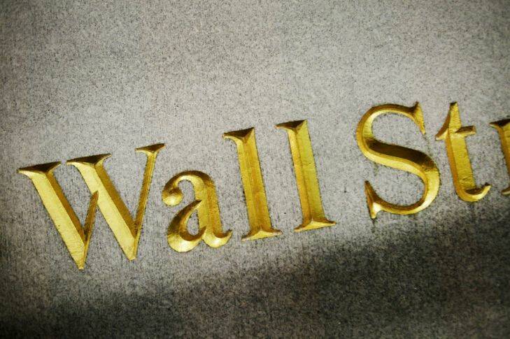 A Wall Street address is carved in the side of a building, Wednesday, Oct. 8, 2014 in New York. European stocks wallowed Wednesday Oct. 15, 2014 on dour growth prospects while Asian shares were mostly higher as a slump in energy prices promised benefits for the region's major economies.  (AP Photo/Mark Lennihan)