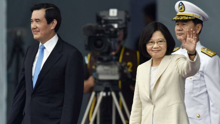 Taiwan's Tsai Ing-wen, right, waves beside incumbent her predecessor President Ma Ying-jeou on Friday. Photo: Kyodo News/AP