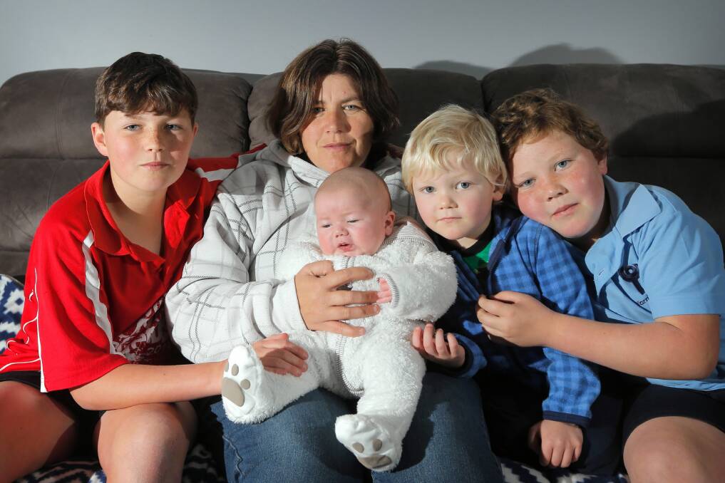 The family of Mark Sayers, son Mitchell, 12, wife Tracy, and sons Zac, seven weeks, William, 3, and Michael, 9, are being supported by the community after the popular umpire survived a heart attack and now has cancer. Picture: TARA GOONAN