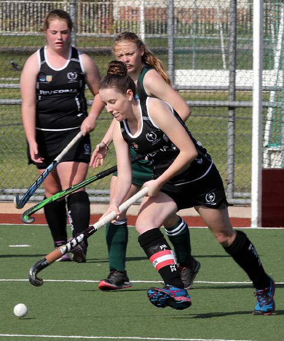 Brooke Purtell controls the ball for the Riverina team in the NSW CHS titles at the Albury Hockey Centre before the deluge. Pictures: PETER MERKESTEYN