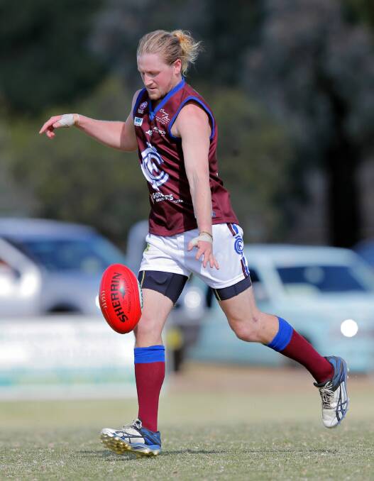 Culcairn’s Scott Fagan sends the ball into attack in the Lions’ 118-point loss to Howlong.