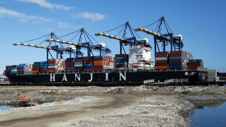 The container ship Hanjin Boston is unloaded at the Port of Los Angeles on Tuesday.  Photo: REED SAXON
