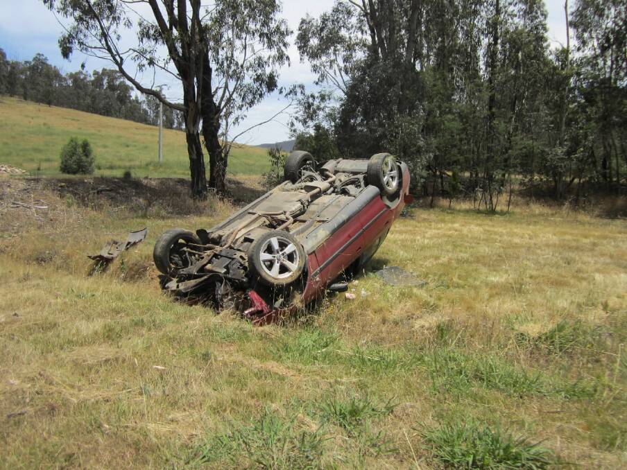 A woman was taken to hospital after her car flipped when it left the Myrtleford-Yackandandah Road. Picture: Victoria Police