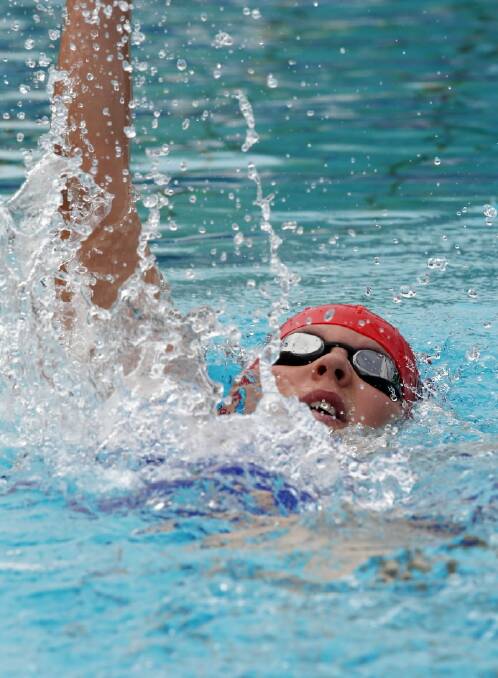 Competing in the boys 12 years 100-metre backstroke, Eddy Ziebarth, 12 of Albury North Lavington.