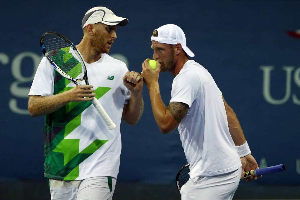 Chris Guccione and Sam Groth discuss tactics during their win over Jonathan Marray and Gilles Muller in the first round of the US Open men’s doubles at Flushing Meadows last week. The pair are in Australia’s Davis Cup team. Picture: GETTY IMAGES