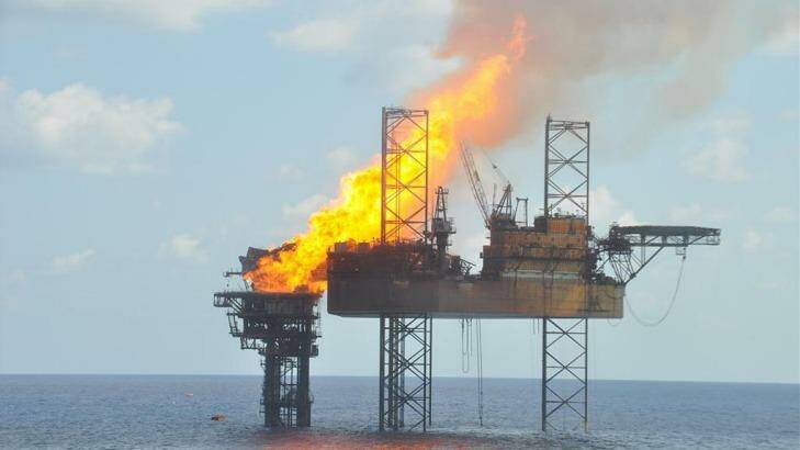 A handout photograph shows a well head platform on fire in the Montara oil field on  November 2, 2009.  Photo: PTTEP Australasia via Bloomberg