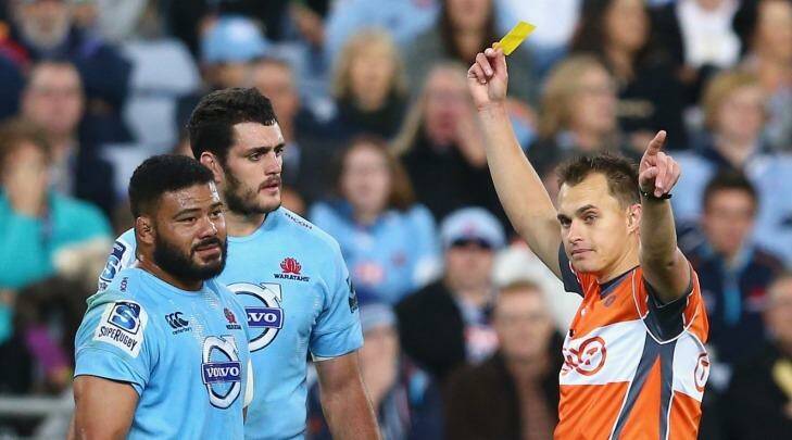 Unhappy: Tolu Latu (left) and David Dennis of the Waratahs look dejected as referee Marius van der Westhuizen shows Latu a yellow card during the round 15 Super Rugby match between the Waratahs and the Crusaders at ANZ Stadium. Photo: Mark Kolbe