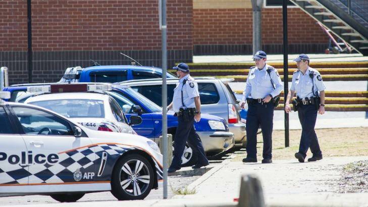 ACT Police officers outside Lanyon High School following a bomb threat. 

2 Feburary 2015
Photo: Rohan Thomson
The Canberra Times Photo: Rohan Thomson