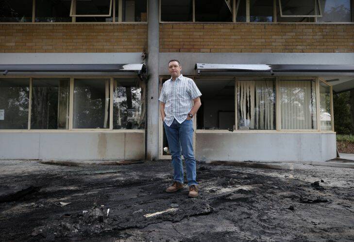 Lyle Shelton managing director of the Australian Christian Lobby examines the scene where a van with gas bottle exploded outside their office in Canberra on Thursday 22 December 2016. Photo: Andrew Meares 