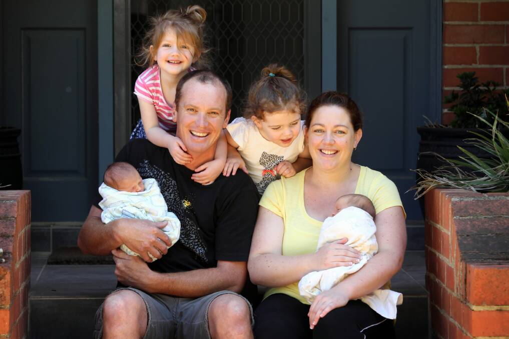 Josh and Jaclyn Muntz with their children Isabelle, 4, Victoria, 2, and newborn twins Grace and Elizabeth, two weeks. All four children have been conceived through the IVF program. Picture: JOHN RUSSELL