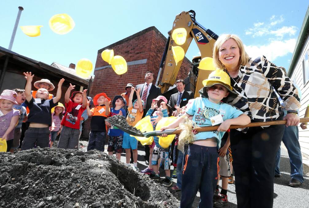 Rueben Dutton, 5, helps Minister for Children and Early Childhood Development Wendy Lovell turn the first sod for the new Tallangatta Integrated Community Centre yesterday. Picture: JOHN RUSSELL