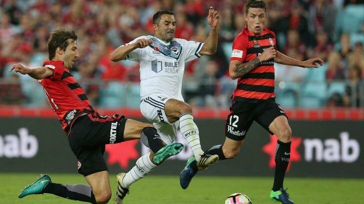 Fahid Ben Khalfallah of the Victory is challenged by Wanderers' Aritz Borda. Photo: Jason McCawley/Getty Images