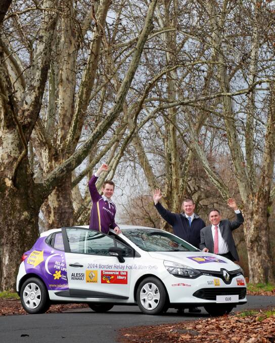 Border Relay for Life chairman Carl Friedlieb, Commercial Club Albury general manager Jeff Duck and Alessi Renault director Tony Alessi, who donated the car for the raffle. Picture: KYLIE ESLER