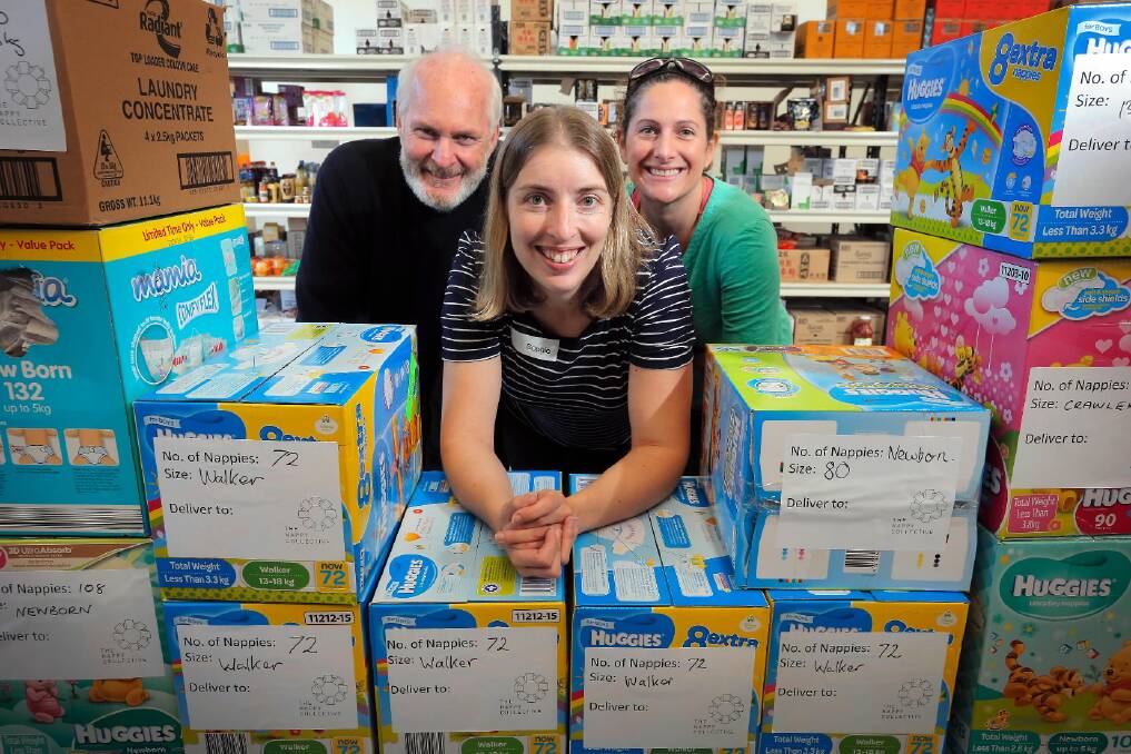 Albury Wodonga Regional Foodshare manager Peter Matthews, The Nappy Collective Albury-Wodonga team leader Sophie Richards and volunteer Penny Collis boxed nappies donated to help mums in need. Picture: KYLIE ESLER