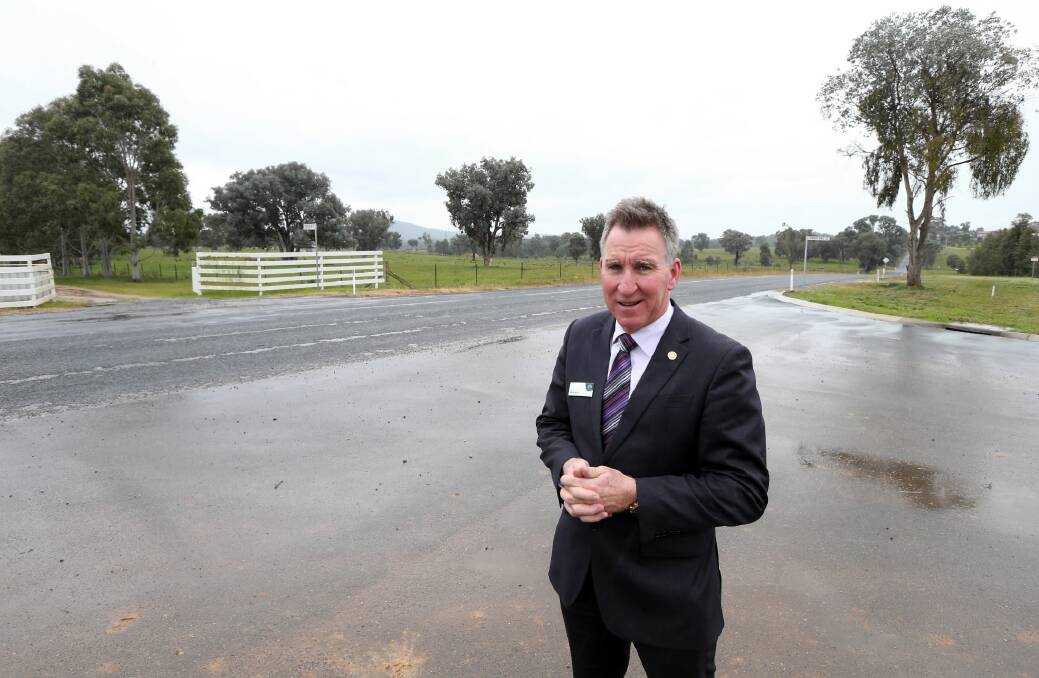 Mayor Kevin Mack stands where the new road was supposed to enter. Picture: PETER MERKESTEYN