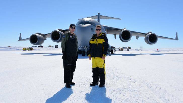 Polar milestone:  Air Commodore Richard Lennon (left) and Australian Antarctic Division director Nick Gales mark the arrival of the RAAF C-17 Globemaster in Antarctica. Photo: Andrew Darby