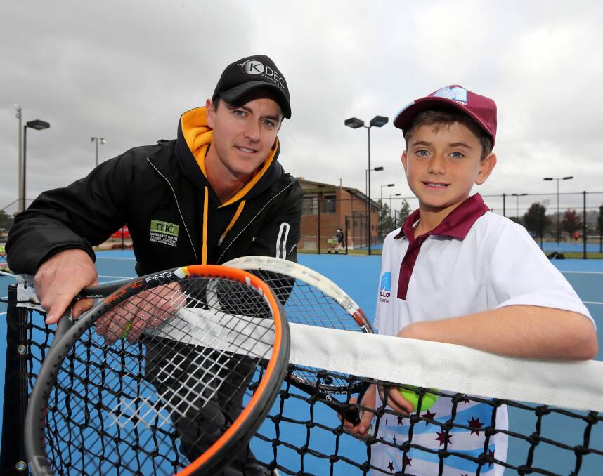 Mark Shanahan and up and coming tennis player, Rory Parnell, 9, of Albury, who has made the seven-member boys NSW primary school state team. Picture: PETER MERKESTEYN
