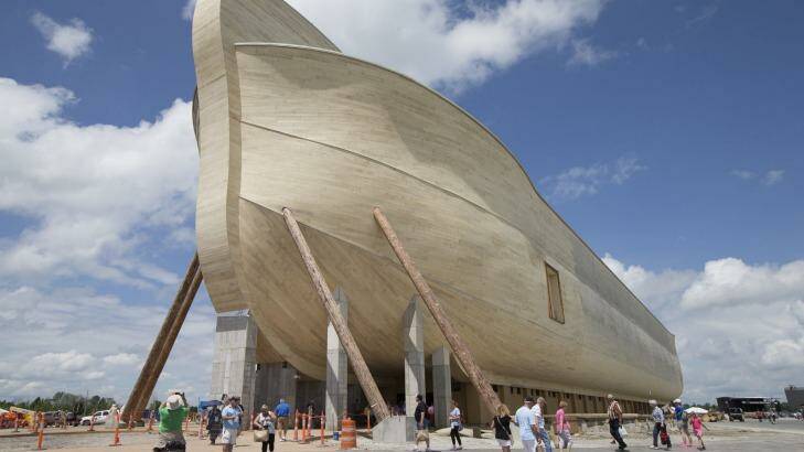 Visitors pass outside the front of a replica Noah's Ark at the Ark Encounter theme park. Photo: AP Photo