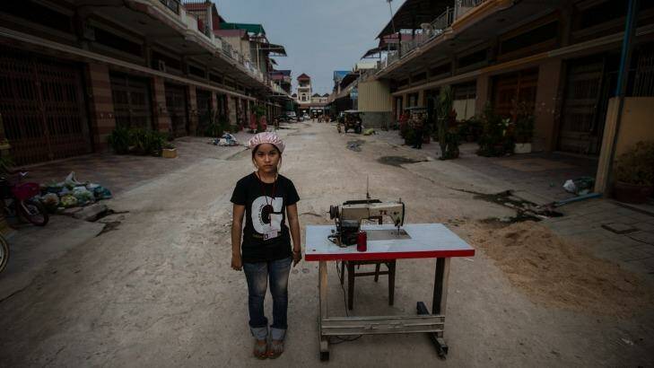 Clothing worker Vien Dyna, 16, says supervisors in a stifling hot Cambodian factory scream abuse at her as she struggles to stitch clothes for fashion brands sold in Western countries like Australia. Photo: Jason South