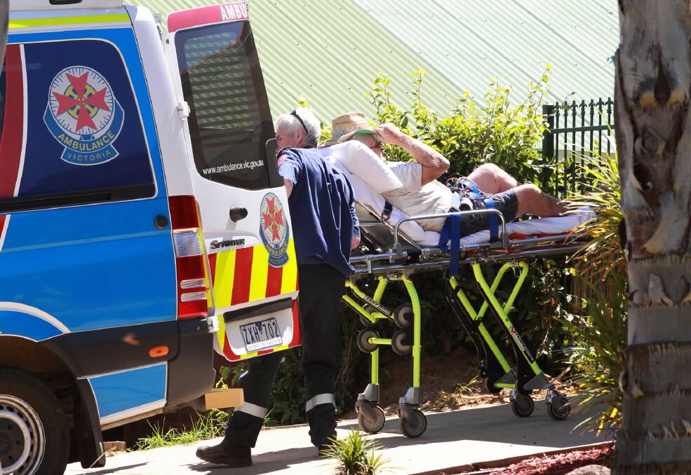 The injured man is off to hospital after the incident at a Wodonga house on Saturday. Picture: KYLIE ESLER