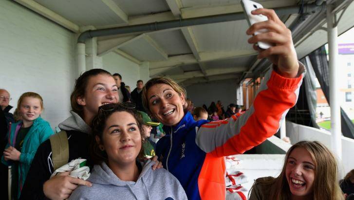 England captain Charlotte Edwards poses for selfies with fans after wet weather delayed the third one-day international of the Women's Ashes series between England and Australia at New Road in Worcester. Photo: Stu Forster