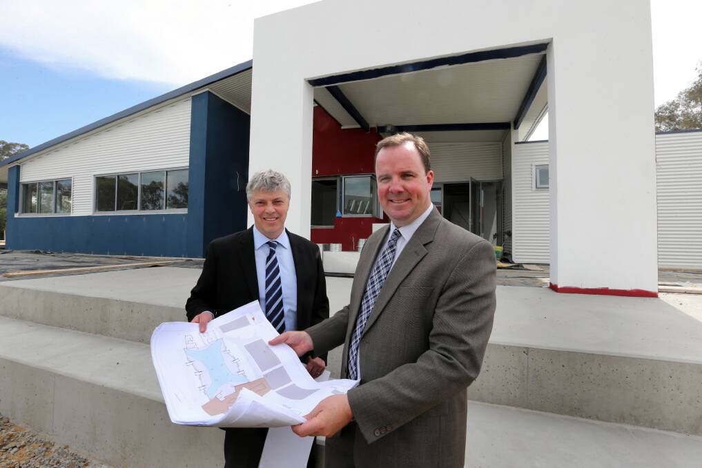 Business manager Greg Davis and principal Steven O’Connor look at the plans. Picture: PETER MERKESTEYN
