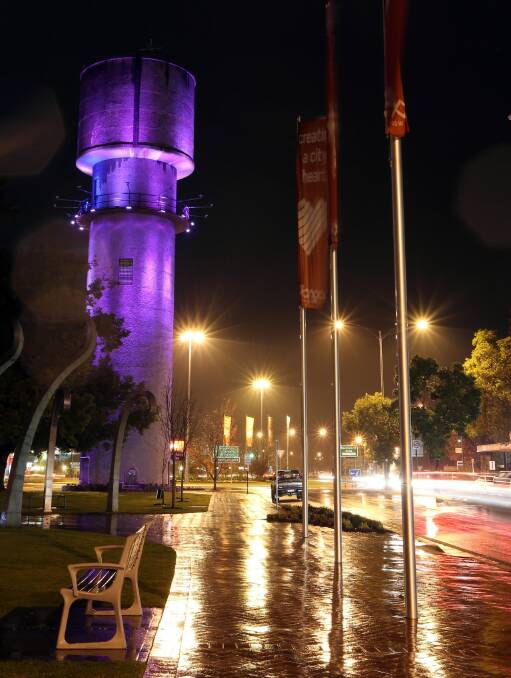 Wodonga’s Water Tower lit was up in purple last night to raise awareness about elder abuse. Picture: PETER MERKESTEYN