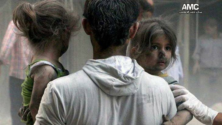 Syrian children are rescued from a building hit by a regime air strike in the Shaar district of Aleppo. Photo: Aleppo Media Centre/File