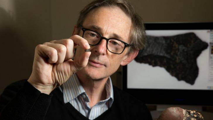 Peter Hiscock with the axe fragment - the oldest in the world. Photo: Janie Barrett