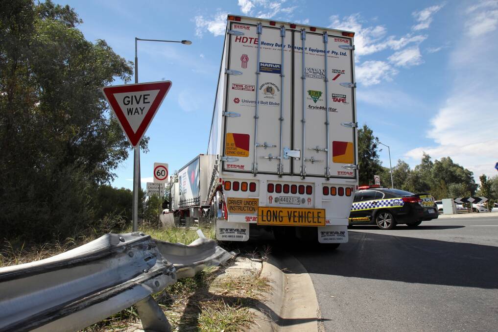 A learner truck driver failed his licence test yesterday when he ran his B-double into a guard railing and become stuck at the Lincoln Causeway intersection in Wodonga. Picture: KYLIE ESLER