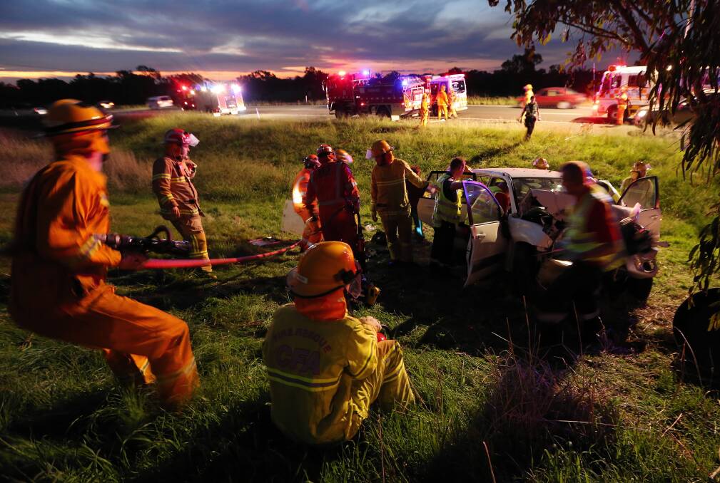 Emergency crews work at the accident scene west of Wodonga last night. Picture: JOHN RUSSELL