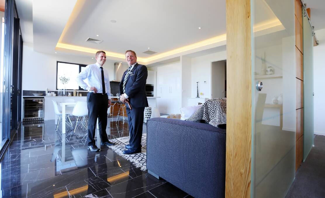 Property manager Nicholas Clark and auctioneer Geoff Stean photographed at the penthouse apartment at The Botanical in Dean Street after it passed in at auction on Saturday. Picture: JOHN RUSSELL