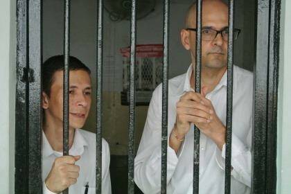 Ferdinant Tjiong (left) and Neil Bantleman, teachers at the newly named 'Jakarta Intercultural School' at the South Jakarta Court to face allegations of sexual assault against students. Photo: Michael Bachelard