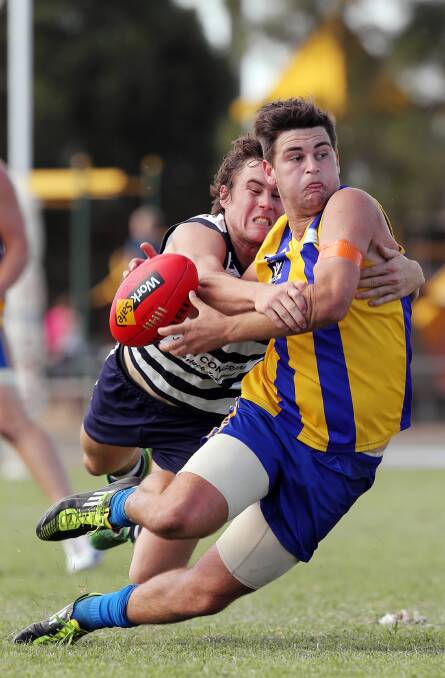 Deniliquin’s Jack Tyndall couldn’t shake free of Cameron Robertson. Picture: JOHN RUSSELL